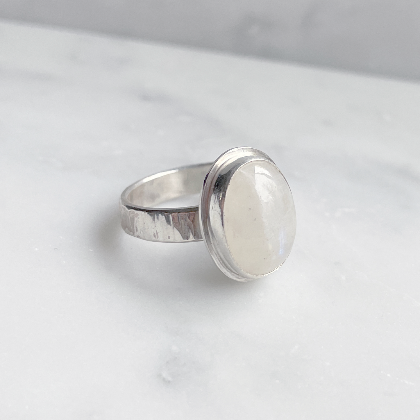 15x10mm oval moonstone ring in silver side view