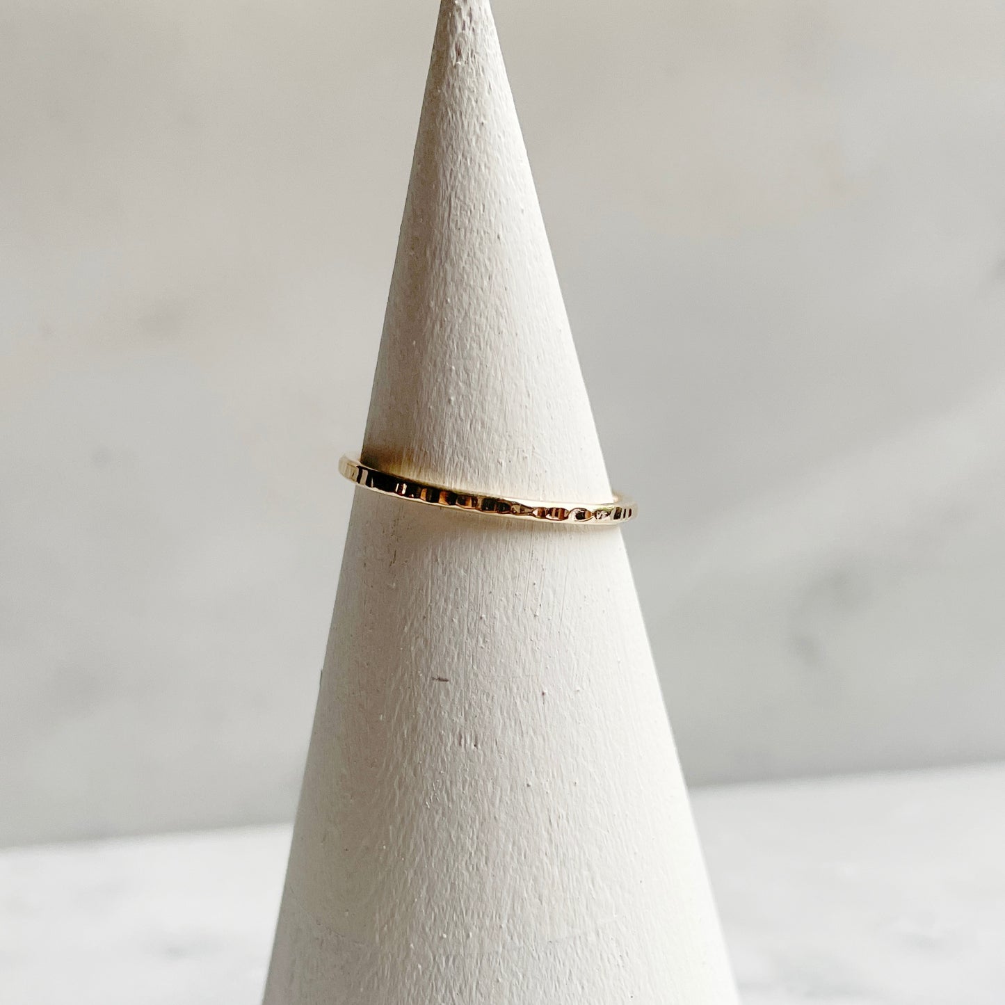 Extra Petite Line hammered band in 14k gold fill on ring cone