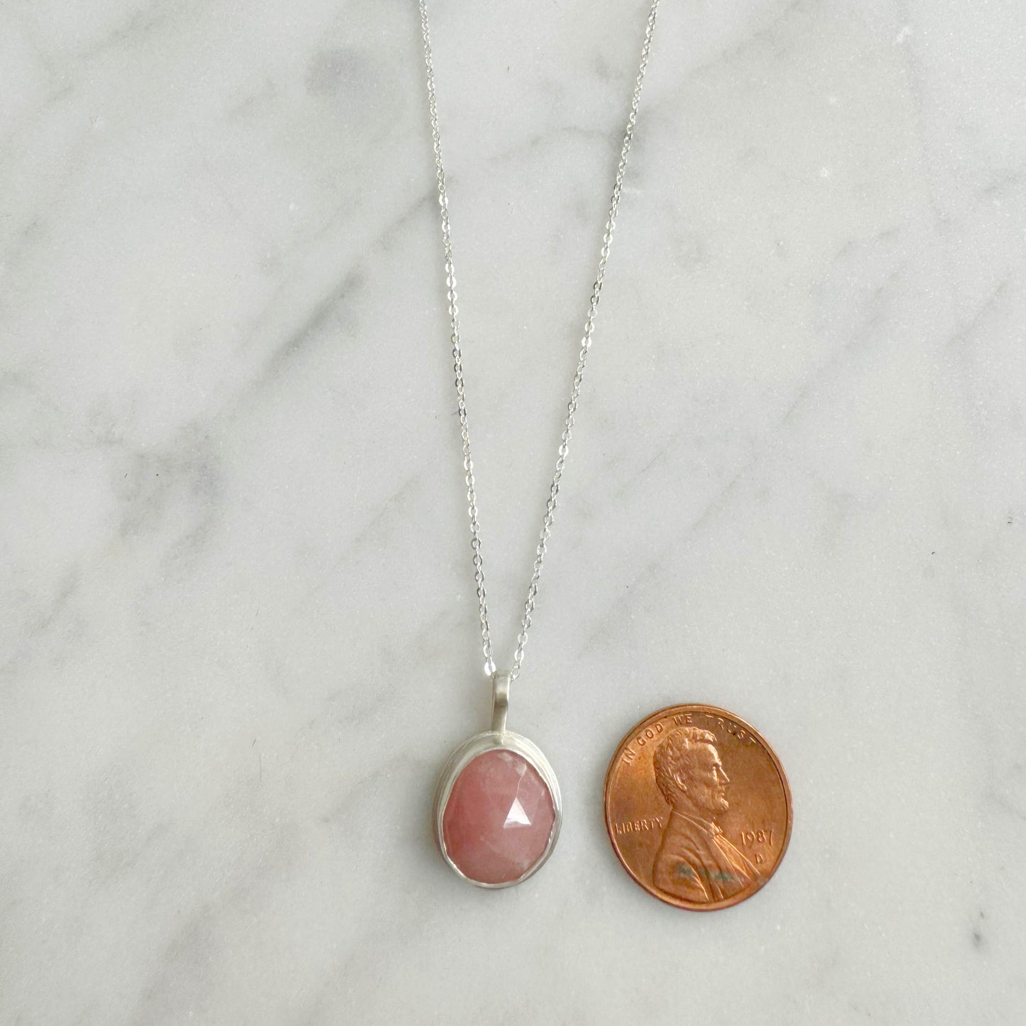 Guava Quartz Necklace next to penny