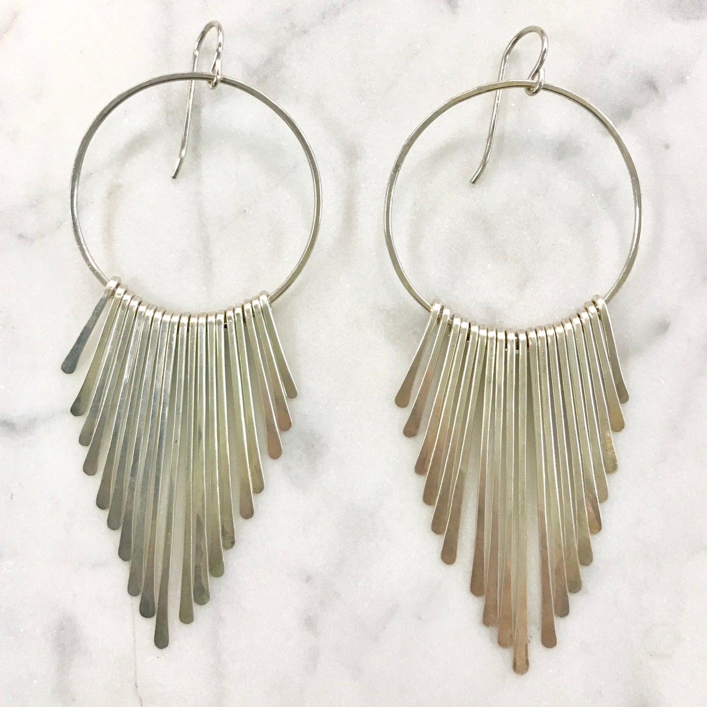 Large radiant rays fringe earrings