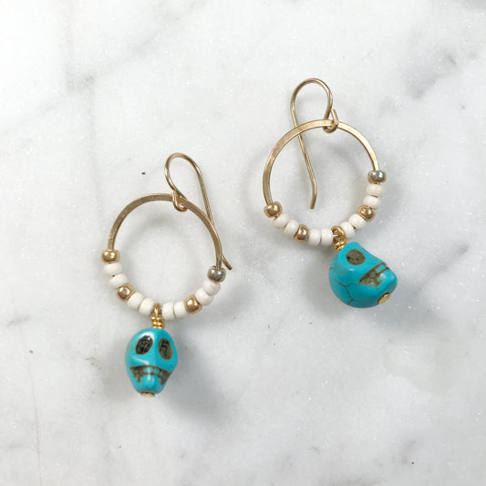 white & blue skull earrings