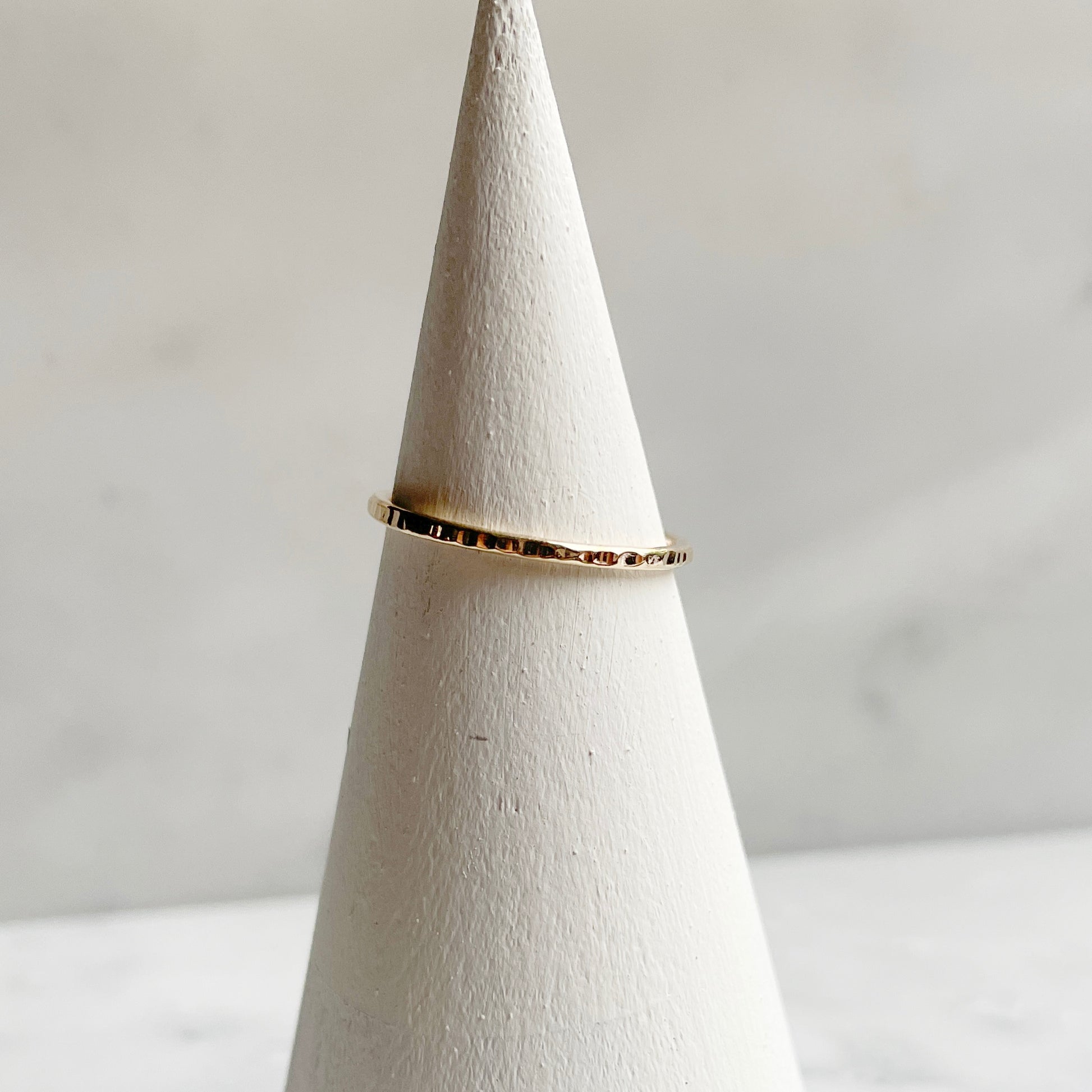 Extra Petite Line hammered band in 14k gold fill on ring cone