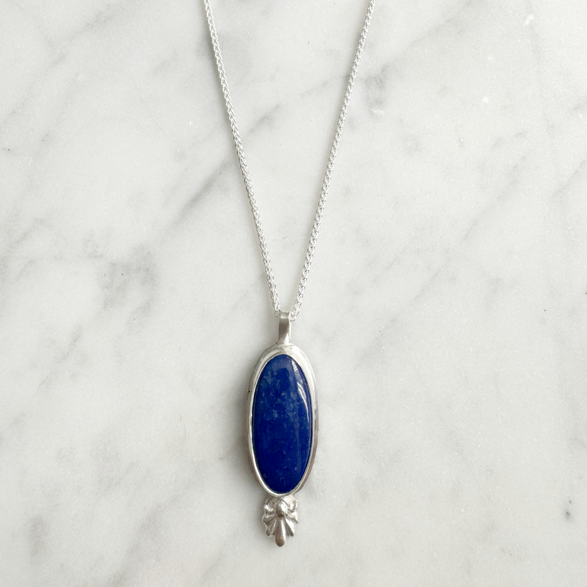 Long Oval Lapis with floral Embellishment Necklace in silver
