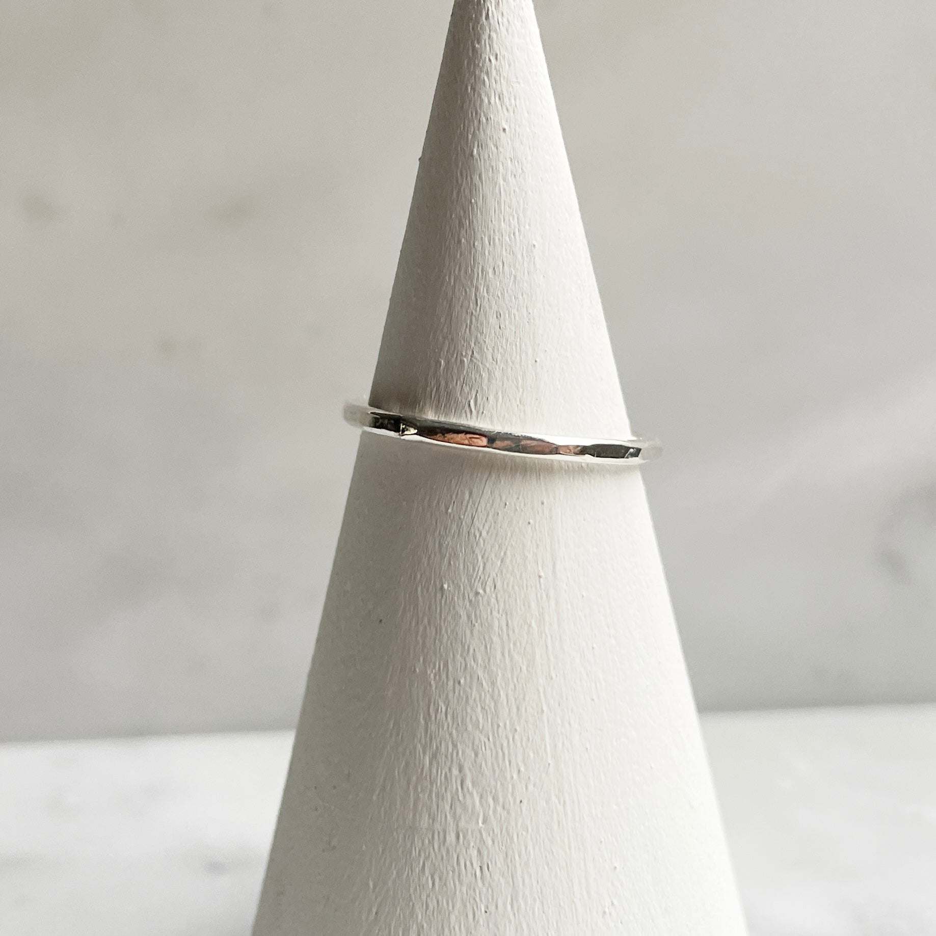 Petite faceted hammered band in silver